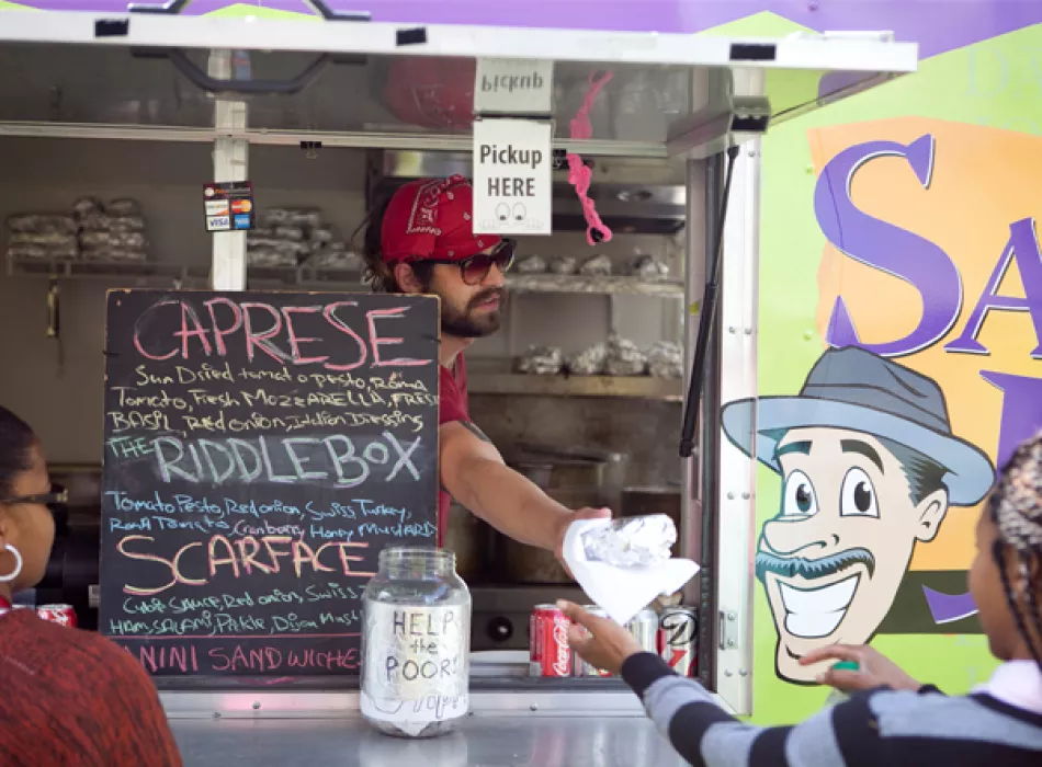 Serving Food at Saucy Joe's Food Truck in Metro Detroit