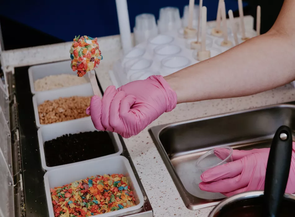 Staff member operating out of our food truck making desserts to order