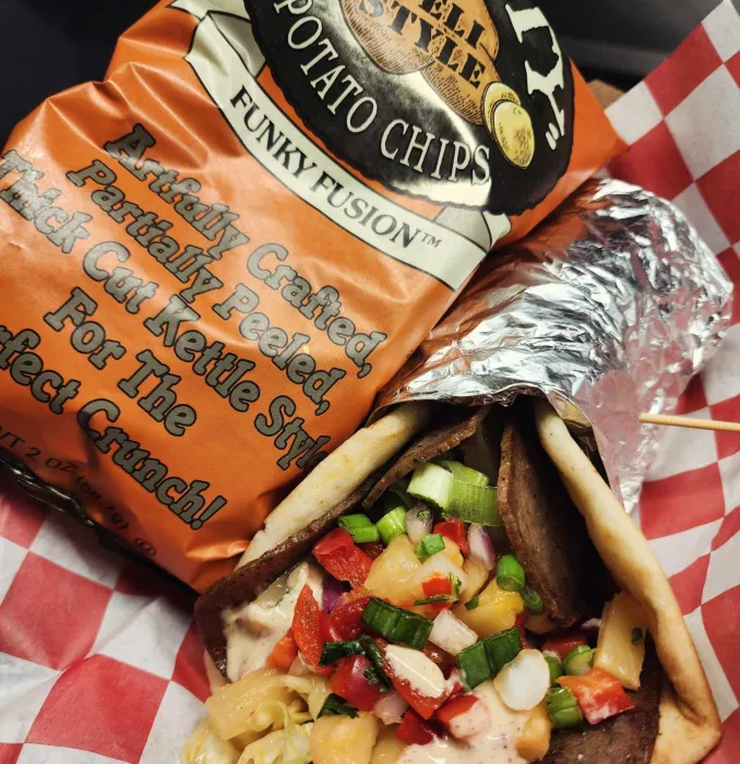 Montego Gyro: Lamb &amp; beef blend, tropical slaw, and tropical pico de gallo, in a warm pita