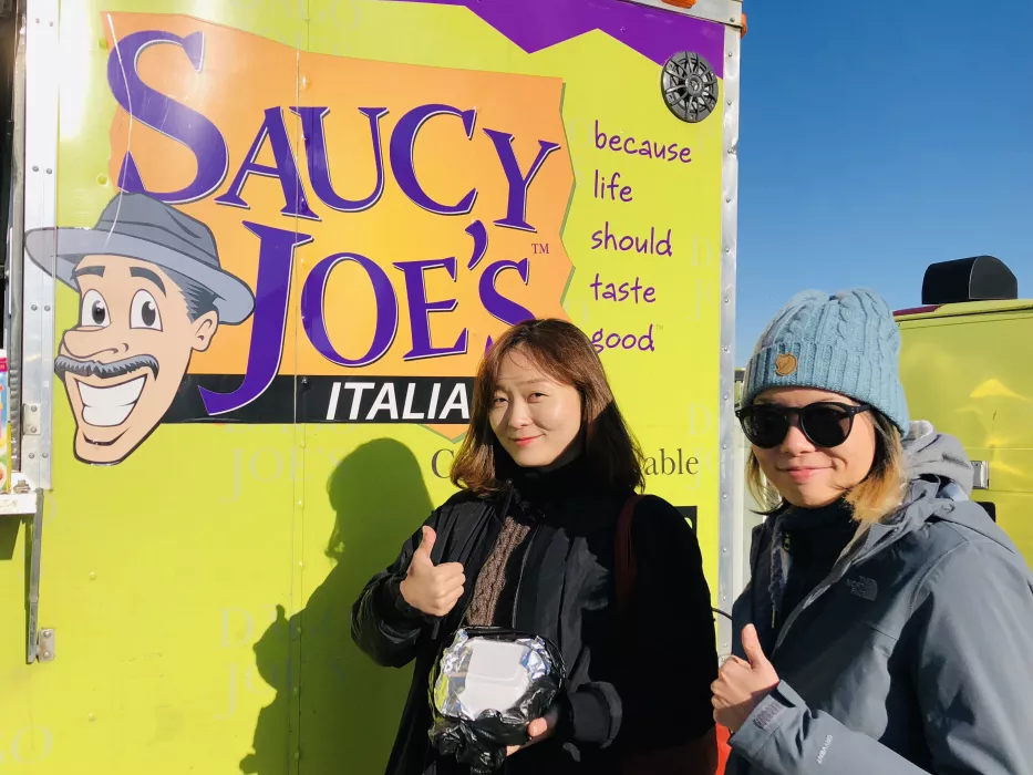 Happy Customers Eating at Saucy Joe's Food Truck &amp; Catering in Metro Detroit