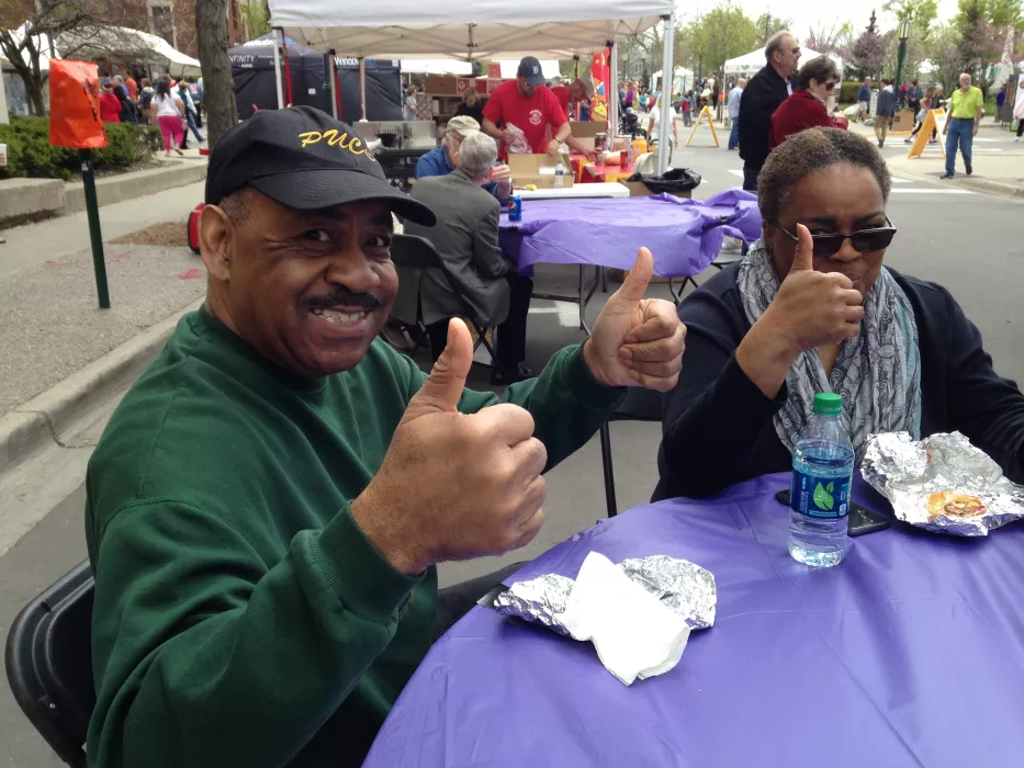 Happy Customers Eating at Saucy Joe's Food Truck &amp; Catering in Metro Detroit