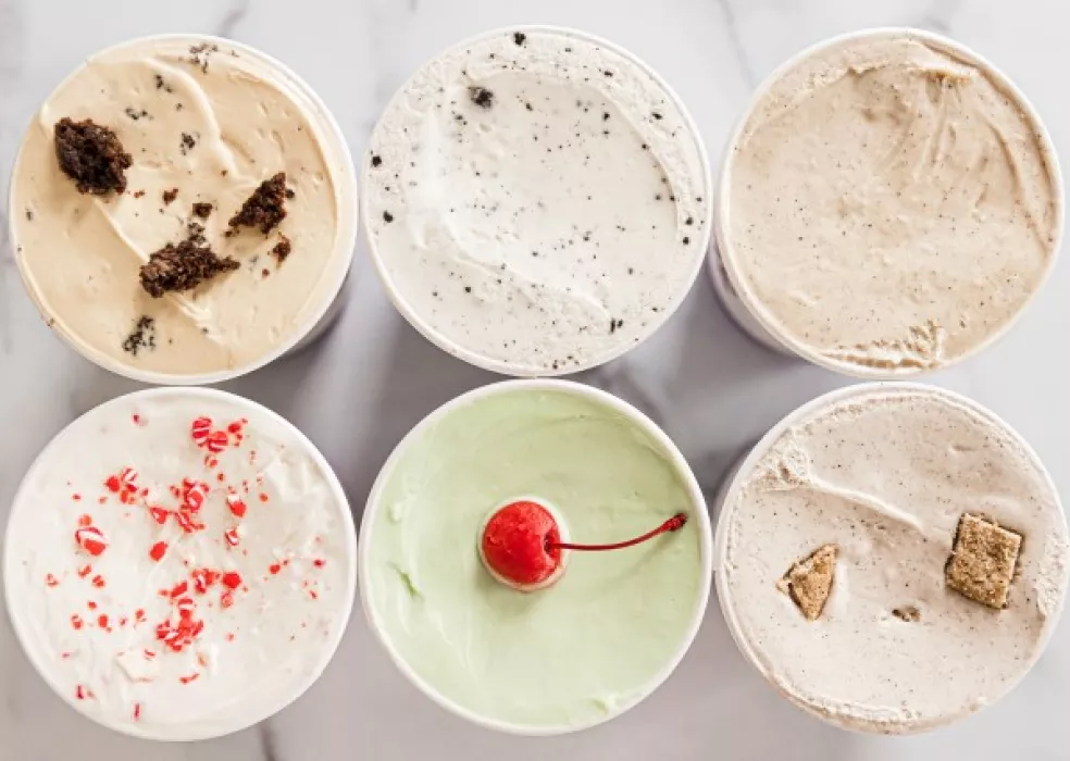 overhead view of six open gelato pints stacked three by three