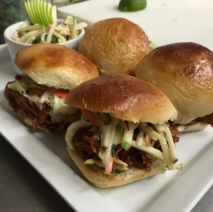 BBQ Pulled Pork Sliders topped with house made Cole Slaw