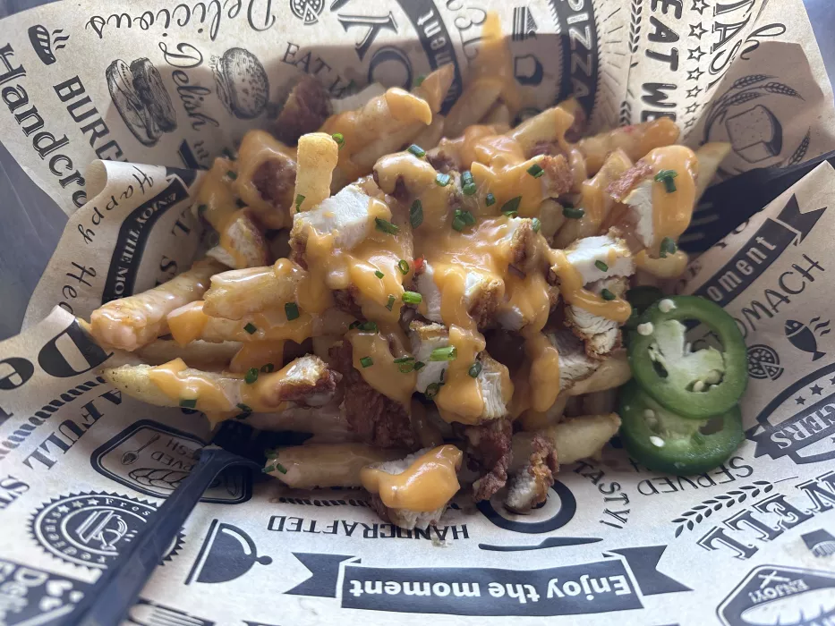 Loaded fried with nacho cheese and char sui pulled pork